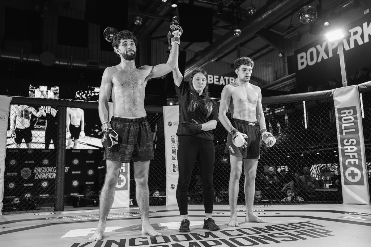 Hand raised by the referee after the fight